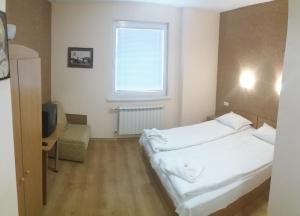 Postel nebo postele na pokoji v ubytování Comfort Guest House