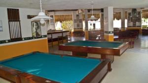 a billiard room with two pool tables in it at Cerca del Mar in Ixtapa