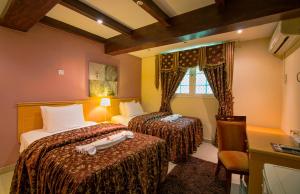 Postel nebo postele na pokoji v ubytování Mutrah Hotel + 37 fotografií