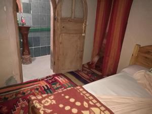 Postel nebo postele na pokoji v ubytování Riad Berbère Boutaghrar