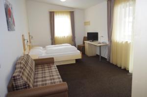 Postel nebo postele na pokoji v ubytování Hotel Montana