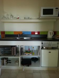 Η κουζίνα ή μικρή κουζίνα στο Ridgehaven Accommodation +12 φωτογραφίες