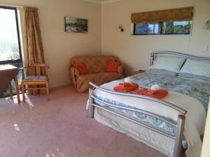 Ένα ή περισσότερα κρεβάτια σε δωμάτιο στο Ridgehaven Accommodation