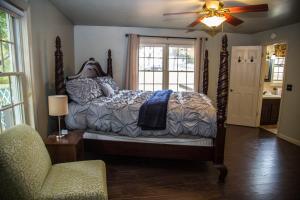 a bedroom with a bed and a ceiling fan at Sunnyside home near Sunday River, Black Mountain, Lakes and Hikes in Rumford