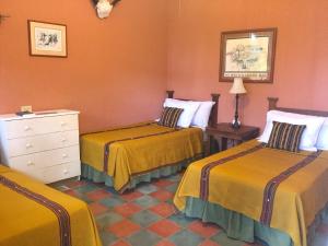 Postel nebo postele na pokoji v ubytování Hotel El Delfin