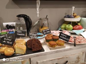 a counter with different types of pastries on it at Guest House Nonna Giulina, camere - Rooms in Castagnole Lanze +33 photos