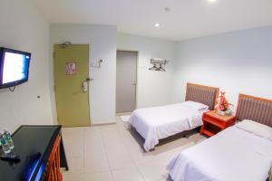 TV a/nebo společenská místnost v ubytování Hotel Rembia