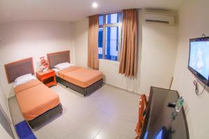 Postel nebo postele na pokoji v ubytování Hotel Rembia