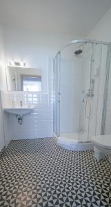 a bathroom with a shower and a sink at Happy Day Apartments in Opole +16 photos