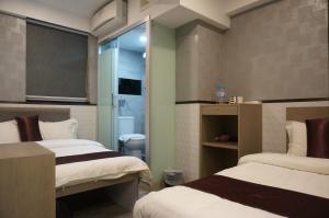 Postelja oz. postelje v sobi nastanitve Vve Vve Hotel