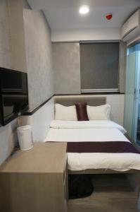 Postelja oz. postelje v sobi nastanitve Vve Vve Hotel