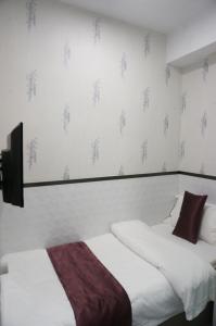 Postelja oz. postelje v sobi nastanitve Vve Vve Hotel
