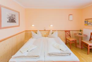 Postel nebo postele na pokoji v ubytování JUFA Hotel Gitschtal