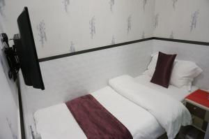 Postelja oz. postelje v sobi nastanitve Vve Vve Hotel