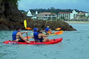 a group of people in kayaks in the water at Dreams Playa Bonita All Inclusive in Playa Bonita Village