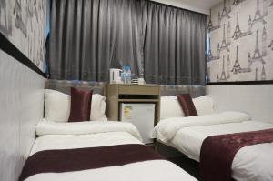 Postelja oz. postelje v sobi nastanitve Vve Vve Hotel