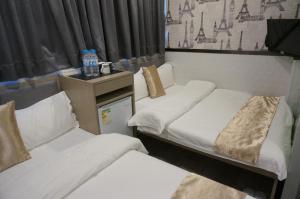 Postelja oz. postelje v sobi nastanitve Vve Vve Hotel