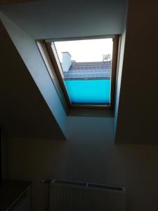 a skylight in a room with a ceiling at Apartment zur Schmiede in Gröbming