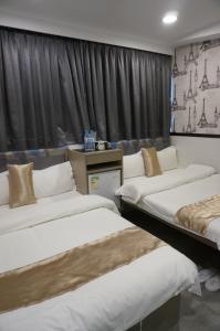 Postelja oz. postelje v sobi nastanitve Vve Vve Hotel