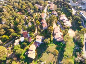 an aerial view of a group of houses at Cala di Sole in Algajola