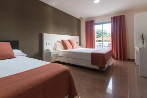 Postel nebo postele na pokoji v ubytování Hotel Pradillo Conil