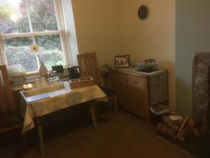 a room with a table and a window at Garth Engan Private Self Contained B&B with Garden Area in Llanbedr
