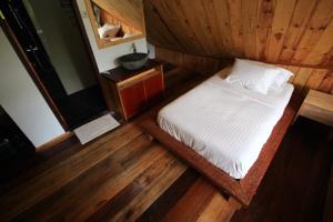 Voodi või voodid majutusasutuse Padi Ecolodge toas