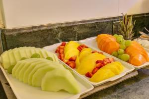 a tray filled with different types of fruits and vegetables at Villas Jurerê Residences in Florianópolis