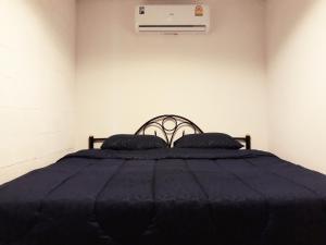 Letto o letti in una camera di P & T Hostel
