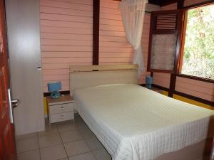En eller flere senge i et værelse på résidence la pointe marine