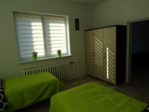 Łóżko lub łóżka w pokoju w obiekcie Apartament Angelo