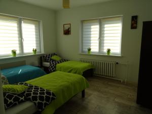Łóżko lub łóżka w pokoju w obiekcie Apartament Angelo