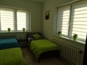 Łóżko lub łóżka w pokoju w obiekcie Apartament Angelo