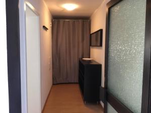 a hallway with a black dresser and a curtain at Ferienwohnung Leitner in Laufenburg