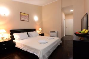 a bedroom with a bed with a bowl of fruit at Luxury Room Uzorita B&B in Šibenik