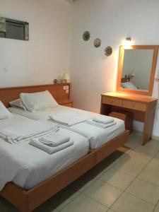 Posteľ alebo postele v izbe v ubytovaní VILLA EIRINI