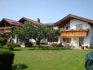 a house with a large yard in front of it at Ferienwohnung Haus Josefa in Burgberg +18 photos