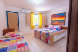 Postel nebo postele na pokoji v ubytování Brisa do Caitá Praia Hotel