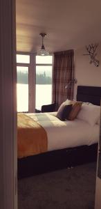 A bed or beds in a room at Airanloch Bed & Breakfast, Loch Ness, Adult Only