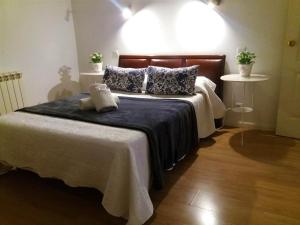 A bed or beds in a room at Casa de Huéspedes Prada