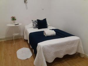 A bed or beds in a room at Casa de Huéspedes Prada