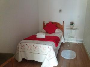 A bed or beds in a room at Casa de Huéspedes Prada