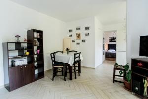 a dining room with a table and chairs at Apartment Tasha's Home in Opatija