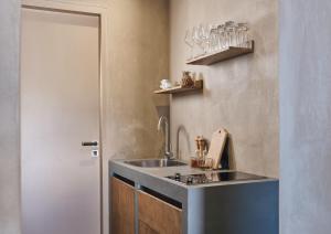 a kitchen with a sink and a counter at Vais Luxury Villas in Agios Nikolaos +37 photos