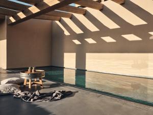 a room with a table and a glass floor at Vais Luxury Villas in Agios Nikolaos
