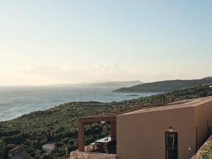 a view of the ocean from a house at Vais Luxury Villas in Agios Nikolaos