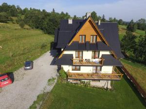 an overhead view of a house with solar panels on it at Willa Floryn in Bukowina Tatrzańska