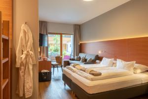 Una cama o camas en una habitación de Mats Lech Alpenquartier