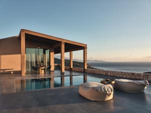 a house with a view of the ocean at Vais Luxury Villas in Agios Nikolaos