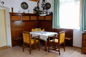 a dining room with a table and chairs at Haus Moser in Öblarn